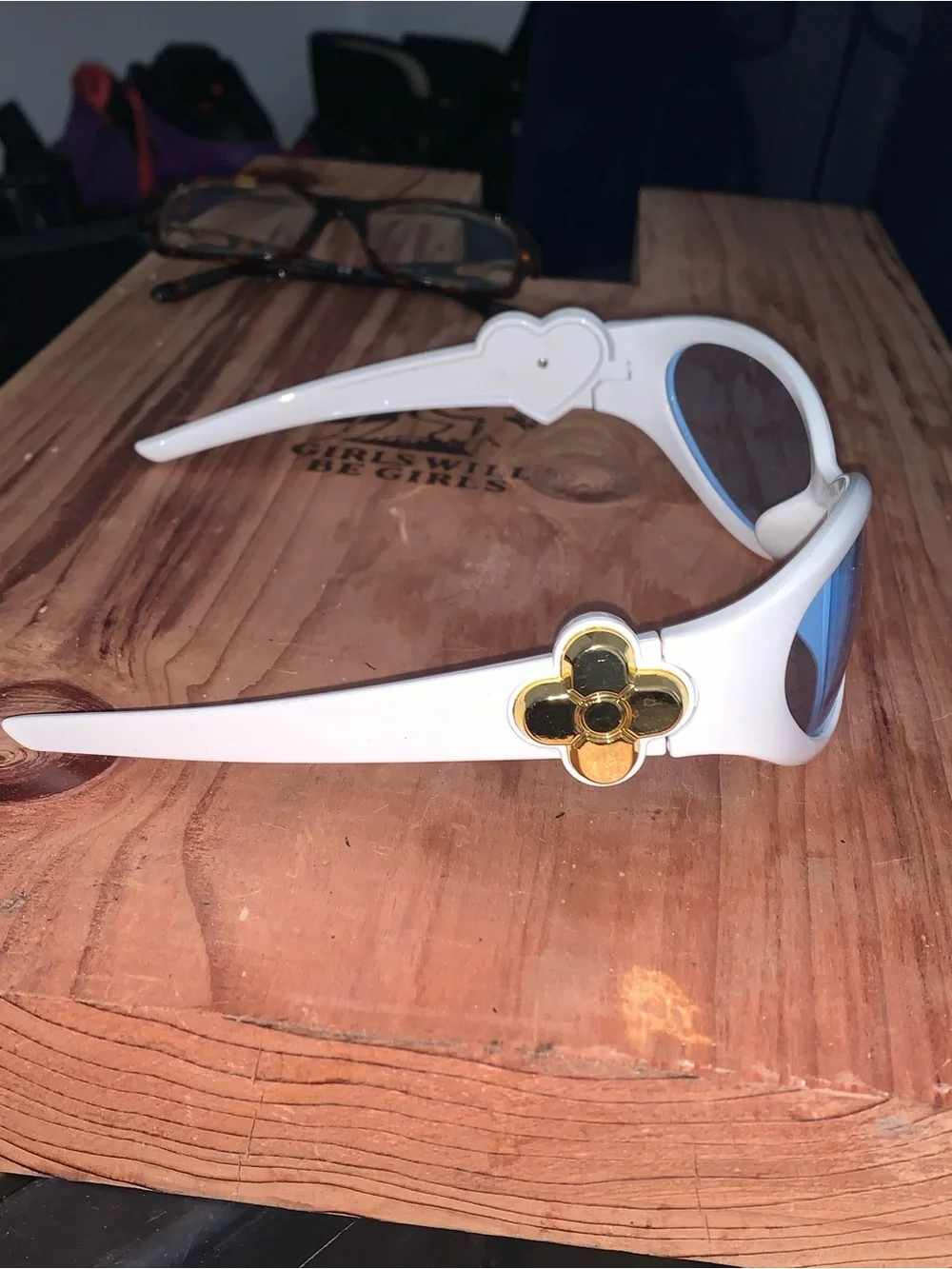 White Oval Sunglasses with Light Blue Lenses